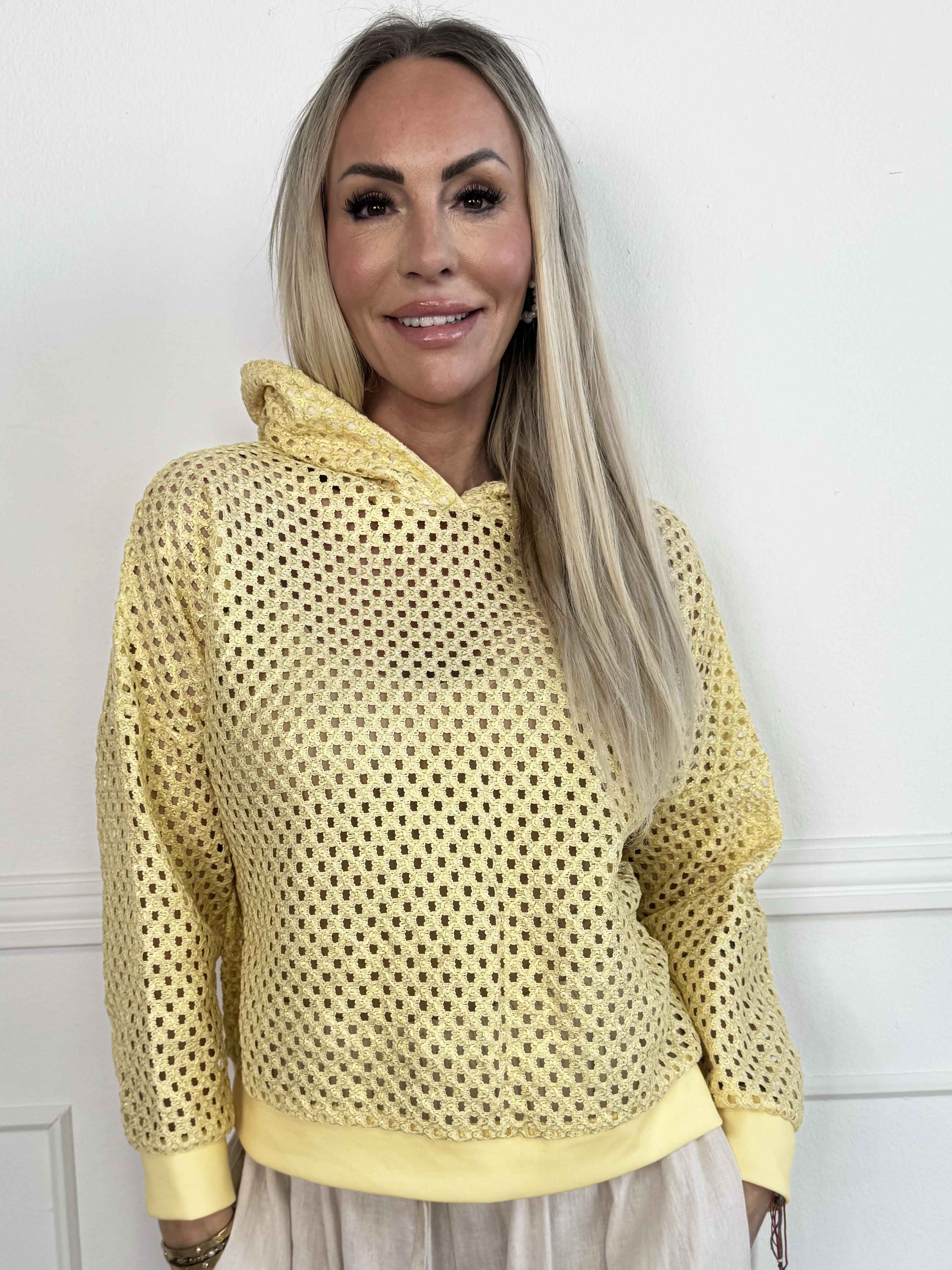 Martha - Hoodie i bomull med hålmönster och lätt glans